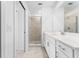 Bathroom featuring glass shower, white vanity, and modern tile at 14191 Heritage Landing Boulevard # 1234, Punta Gorda, FL 33955