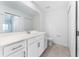 This bright bathroom features a toilet, vanity, and tiled floor at 14191 Heritage Landing Boulevard # 1234, Punta Gorda, FL 33955