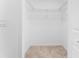 Walk-in closet with carpet flooring and wire shelving at 14191 Heritage Landing Boulevard # 1234, Punta Gorda, FL 33955