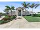 Front view of the community clubhouse with manicured landscaping at 14191 Heritage Landing Boulevard # 1234, Punta Gorda, FL 33955