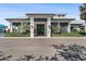Well maintained clubhouse front view with trimmed bushes and concrete at 14191 Heritage Landing Boulevard # 1234, Punta Gorda, FL 33955