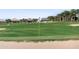 Scenic view of a lush green golf course with sand trap and flag at 14191 Heritage Landing Boulevard # 1234, Punta Gorda, FL 33955