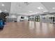Large gym featuring a full range of exercise equipment and a door to the outside at 14191 Heritage Landing Boulevard # 1234, Punta Gorda, FL 33955