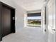 Condo hallway with elevator and balcony showcasing neighborhood views at 14191 Heritage Landing Boulevard # 1234, Punta Gorda, FL 33955