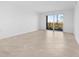 Bright, airy living room with sliding glass doors that open to a screened lanai at 14191 Heritage Landing Boulevard # 1234, Punta Gorda, FL 33955