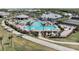 A luxurious community pool featuring ample seating, palm trees, and a great place to relax and enjoy the Florida sun at 14191 Heritage Landing Boulevard # 1234, Punta Gorda, FL 33955
