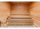 Relaxing wood sauna featuring multi-level bench seating and temperature gauge at 14191 Heritage Landing Boulevard # 1234, Punta Gorda, FL 33955