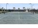Up close exterior view of well maintained tennis court with net at 14191 Heritage Landing Boulevard # 1234, Punta Gorda, FL 33955