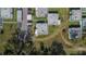 An aerial view of a residential community with well-maintained landscaping and convenient carport parking at 206 Andover N Pl # 96, Sun City Center, FL 33573