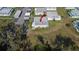Overhead aerial shot of a charming home in a well-maintained community surrounded by lush greenery at 206 Andover N Pl # 96, Sun City Center, FL 33573