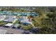 Overhead aerial view of a charming home in a well-maintained community with mature trees, and carports at 206 Andover N Pl # 96, Sun City Center, FL 33573