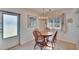 Charming dining area featuring a chandelier, natural light, and traditional wooden furniture at 206 Andover N Pl # 96, Sun City Center, FL 33573