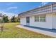 Charming exterior view of home featuring a low-maintenance yard, door and window trim, and a sidewalk at 206 Andover N Pl # 96, Sun City Center, FL 33573