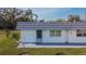 Charming exterior view of home featuring a low-maintenance yard, door and window trim, and a sidewalk at 206 Andover N Pl # 96, Sun City Center, FL 33573
