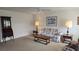 Inviting living room with floral sofa, ceiling fan, and classic decor at 206 Andover N Pl # 96, Sun City Center, FL 33573