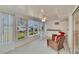 Enclosed sunroom with two chairs and a window at 206 Andover N Pl # 96, Sun City Center, FL 33573