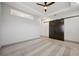 Spacious bedroom with neutral walls, barn door, ceiling fan, tray ceiling and carpeted floors at 2334 2Nd S Ave, St Petersburg, FL 33712