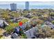Beautiful aerial view of townhomes, mature trees, and a glimpse of the bay in the distance at 2515 S Ysabella Ave, Tampa, FL 33629