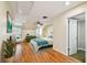 Bright bedroom with hardwood floors, ceiling fan and chair at 2515 S Ysabella Ave, Tampa, FL 33629