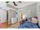 Bedroom with hardwood floors, dresser and rug leading to a doorway at 2515 S Ysabella Ave, Tampa, FL 33629