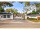 Gated community entrance featuring the name 'Crowder Manor' surrounded by beautiful trees and landscaping at 2515 S Ysabella Ave, Tampa, FL 33629