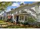 Street view of the townhome featuring beautiful landscaping and a well-maintained lawn at 2515 S Ysabella Ave, Tampa, FL 33629