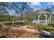 Picturesque gazebo surrounded by lush greenery and a meticulously maintained landscape at 2515 S Ysabella Ave, Tampa, FL 33629
