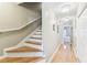 Inviting hallway features hardwood floors, staircase, and decorative lighting at 2515 S Ysabella Ave, Tampa, FL 33629