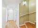 Bright entryway featuring hardwood floors, a staircase and a coat closet at 2515 S Ysabella Ave, Tampa, FL 33629