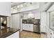 Bright kitchen with white cabinets, stainless steel appliances, and tile floors at 2515 S Ysabella Ave, Tampa, FL 33629
