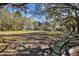 Park with a bench, trees, grass, walking trails, and a gazebo in a peaceful and scenic environment at 2515 S Ysabella Ave, Tampa, FL 33629