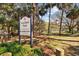 Fred Ball Park sign featuring lush greenery and a glimpse of the expansive park at 2515 S Ysabella Ave, Tampa, FL 33629