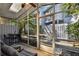 Enclosed porch featuring lots of space, ceiling fan and lighting at 2515 S Ysabella Ave, Tampa, FL 33629