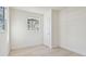 Bright bedroom featuring neutral walls, light wood floors, closet and natural light from a window at 2801 N 75Th St, Tampa, FL 33619