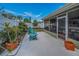 Charming back yard with a screened-in patio and lush landscaping at 3111 Teal Ter, Safety Harbor, FL 34695