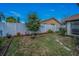 Backyard featuring a green lawn, stone path, and an ornamental tree at 3111 Teal Ter, Safety Harbor, FL 34695