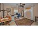 Bedroom featuring a ceiling fan, computer desk with computer and a decorative patterned rug at 3111 Teal Ter, Safety Harbor, FL 34695