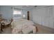 Comfortable bedroom with neutral tones, a ceiling fan, and ample closet space at 3111 Teal Ter, Safety Harbor, FL 34695