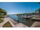 Scenic boat marina view featuring sailboats docked in the water, a wooden pier, and lush landscaping at 3111 Teal Ter, Safety Harbor, FL 34695