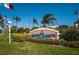 Community Entrance features lush landscaping around a welcome sign, creating an inviting first impression at 3111 Teal Ter, Safety Harbor, FL 34695