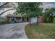 Alluring single-story home with attached two-car garage and mature landscaping at 3111 Teal Ter, Safety Harbor, FL 34695