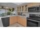 Modern kitchen with stainless steel appliances and ample cabinet space at 3111 Teal Ter, Safety Harbor, FL 34695