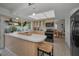Bright kitchen featuring an island, tile floors, and appliances at 3111 Teal Ter, Safety Harbor, FL 34695