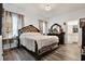 Primary bedroom showcasing a decorative bedframe, and ensuite bathroom at 35530 Shade Fern Ln, Zephyrhills, FL 33541