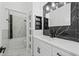 Modern bathroom with black and white marble accents, a spacious vanity, and a shower at 3817 105Th N Ave, Clearwater, FL 33762