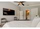 Comfortable main bedroom with TV, ceiling fan, and private bathroom access at 402 S Willow Ave # D, Tampa, FL 33606