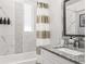Charming bathroom featuring a shower/tub combination with a decorative shower curtain at 4104 E Comanche Ave, Tampa, FL 33610