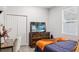 Bright bedroom with a modern dresser and a large window at 4104 E Comanche Ave, Tampa, FL 33610