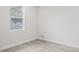Bright bedroom with a window and light gray walls at 4104 E Comanche Ave, Tampa, FL 33610