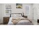 Cozy bedroom with a comfortable bed, bedside tables, and natural lighting at 4104 E Comanche Ave, Tampa, FL 33610